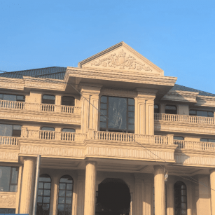 长沙黄金麻别墅外墙干挂石材效果示例